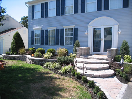 Curved stone staircase with landscaping